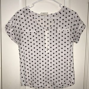 A black polka-dot blouse